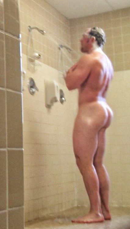 Nude men in gym shower