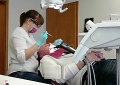 Being tightly gloved dentist