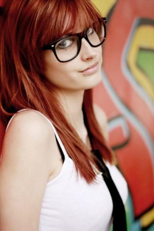 Hot redhead girl with nerd glasses