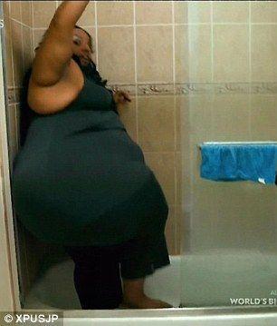 Overweight african women in shower