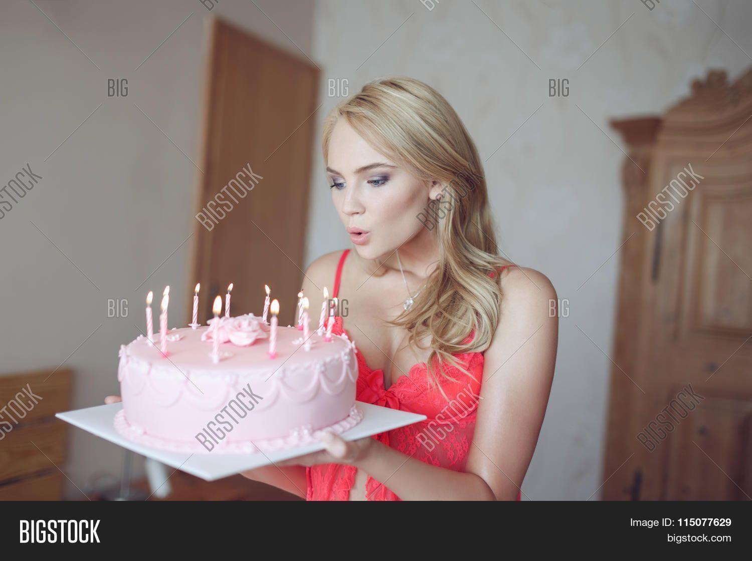 Sexy girl blowing a candle