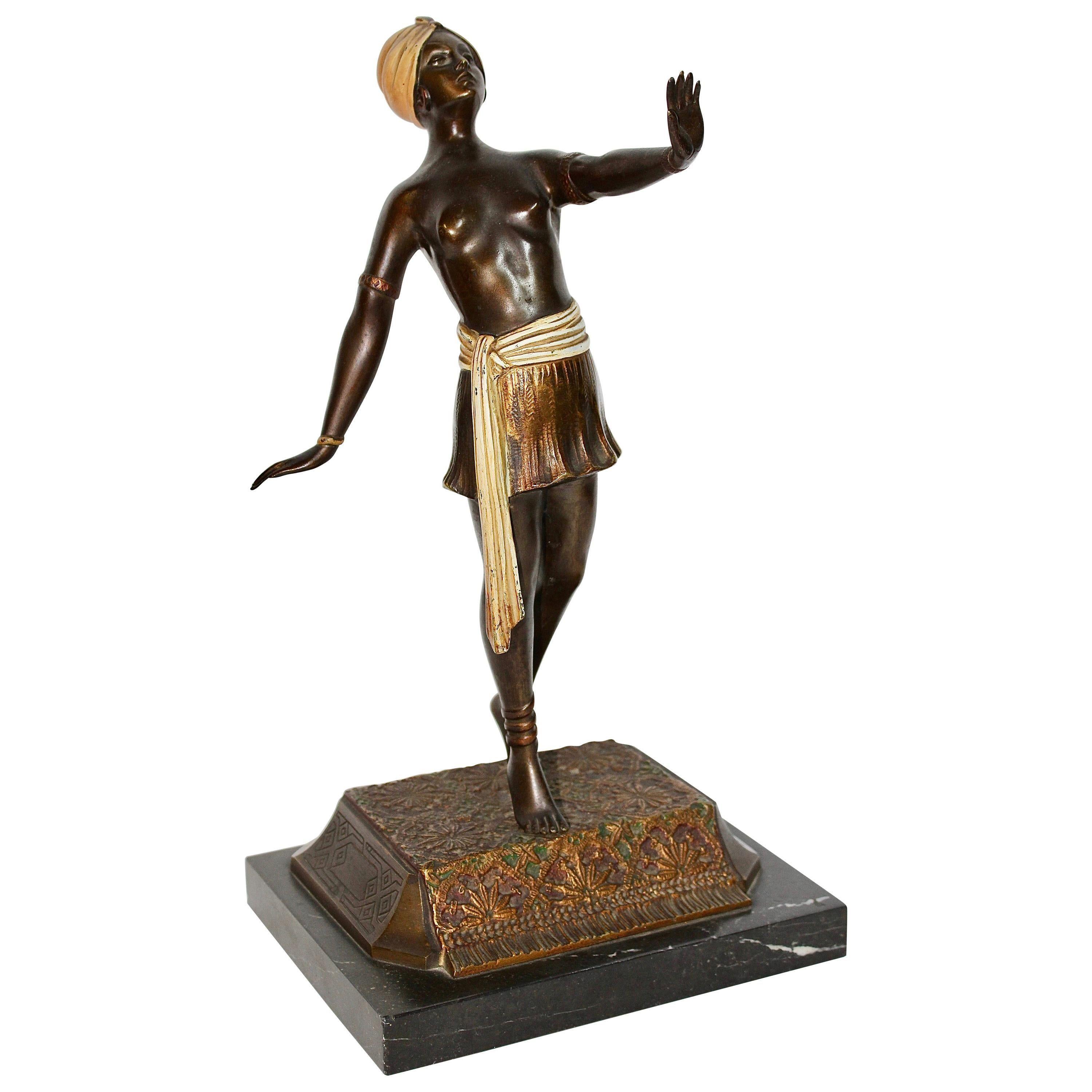 Antique bronze naked dancer