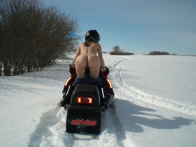 Nude wife on snowmobile