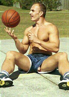 Nudist playing basketball