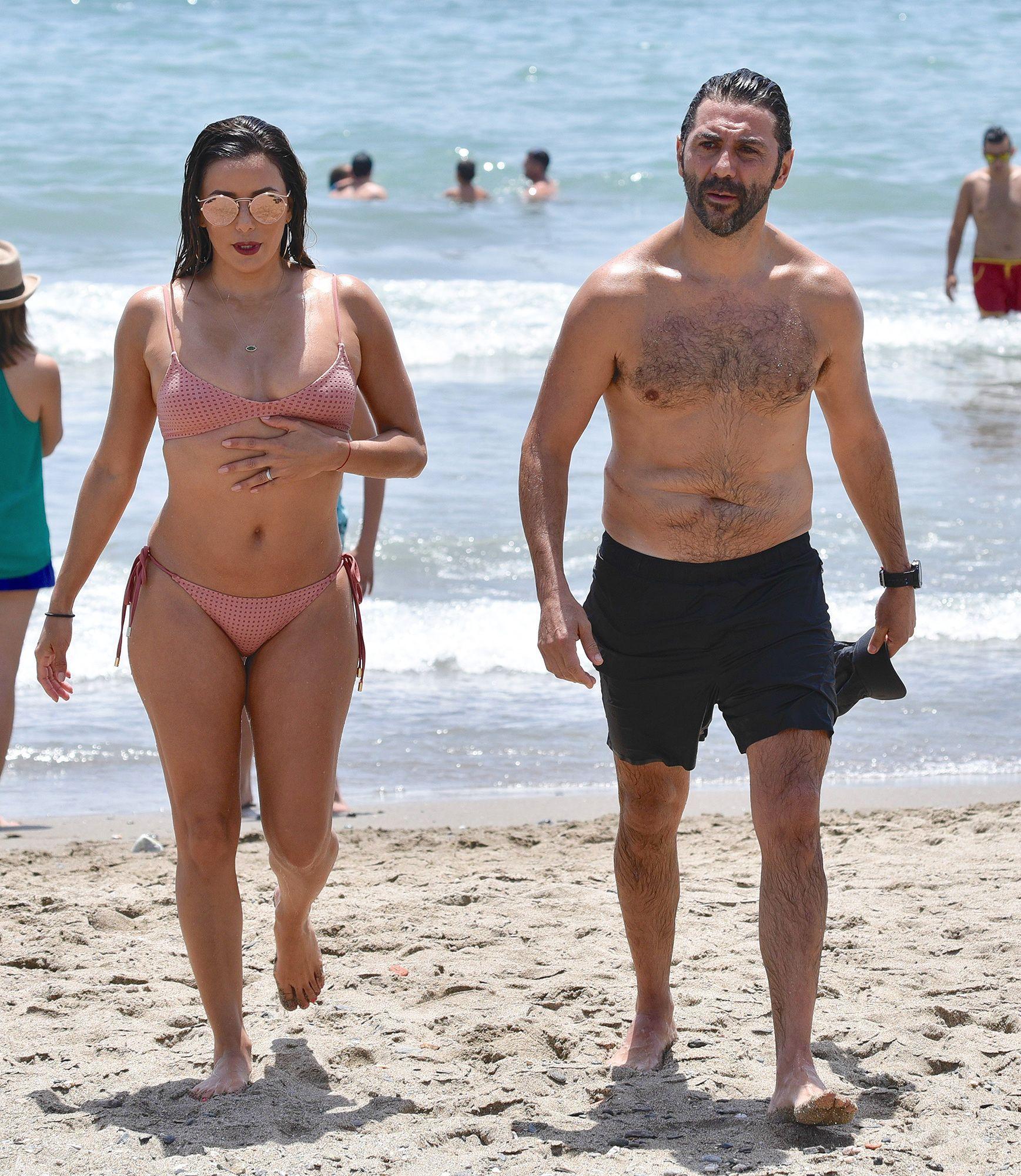 Nikki Brazil naked on the beach.