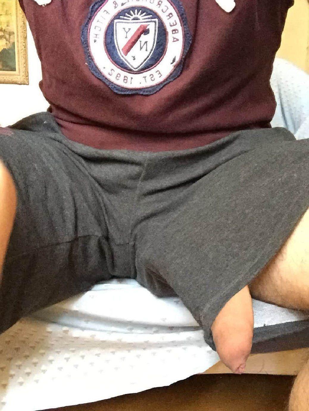 Cock poking through shorts